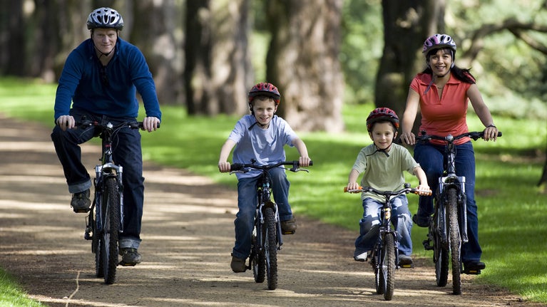 A family cycling together